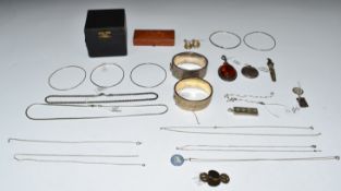 A collection of silver jewellery including ingot, chains, St Christopher, bangles, charm bracelet
