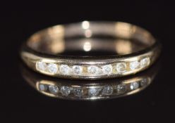 A 9ct gold ring set with nine diamonds,1.6g, size K