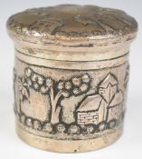 Burmese or similar silver pot with embossed decoration of palm trees, buildings and figures, stamped