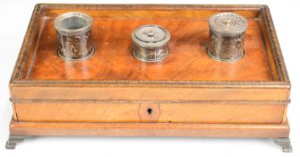 Regency mahogany standish with white metal pounce pot, inkwell and single inlaid straight drawer