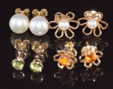 Four pairs of 9ct gold earrings comprising two set with pearls, one with peridot and the other