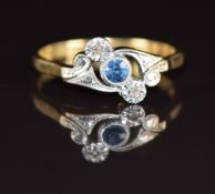 An 18ct gold ring set with a sapphire and diamonds in a platinum setting, 3g, size O