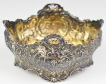 Victorian hallmarked silver bowl with embossed decoration, raised on four feet, with import marks