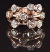 A 9ct rose gold ring set with diamonds the total diamond weight approximately 1.35ct, 4.7g, size N