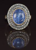 A silver ring set with a tanzanite of approximately 5.38ct and diamonds totalling approximately 0.