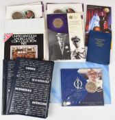 Various Royal Mint commemorative crowns in presentation packs, and two small empty coin albums