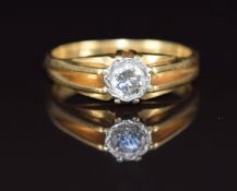 An 18ct gold ring set with a round cut diamond of approximately 0.4ct, 5.7g, size Q