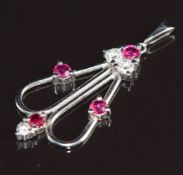 A platinum pendant set with diamonds and rubies, 2g, 2.5cm