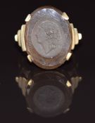 A 9ct gold ring set with a carved smoky quartz intaglio depicting a cameo of a woman, 6.8g, size L