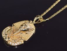 Egyptian 18ct gold pendant in the form of Tutankhamen (3 x 2.5cm) and chain (48cm long), 15.4g