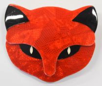 Lea Stein brooch in the form of a cat's head in red and black, 5.7 x 4.5cm