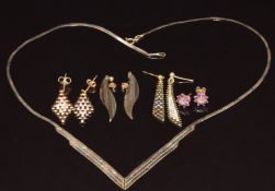 A 9ct gold tri-coloured ribbon necklace and four pairs of 9ct gold earrings, one pair set with a