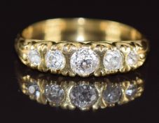 An 18ct gold ring set with five old cut diamonds, the total diamond weight approximately 0.7ct, 5.