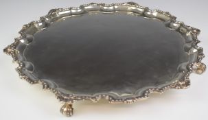 Mappin & Webb Elizabeth II hallmarked silver salver with shaped decorative edge, raised on four