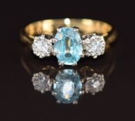 An 18ct gold ring set with an oval cut zircon and diamonds, 3g, size K