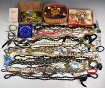 A collection of costume jewellery including watches, vintage brooches, necklaces, sewing related
