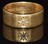 An 18ct gold ring set with an old cut diamond in a star setting, Birmingham 1921, 7g, size R
