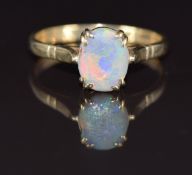 A 9ct gold ring set with an opal, 3.3g, size V