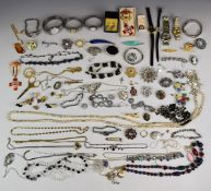 A collection of costume jewellery including silver brooch in the form of a feather set with