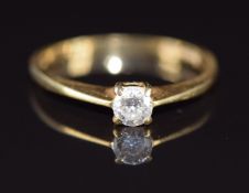 An 18ct gold ring set with a round cut diamond of approximately 0.2ct, 2g, size K