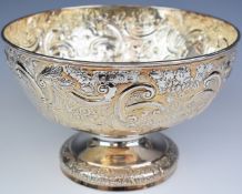 Victorian hallmarked silver punch bowl with embossed decoration and vacant cartouches to each