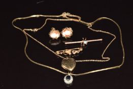 A 9ct gold heart locket on chain (2.7g, 1.8cm), 9ct gold pendant set with a sapphire and diamonds,