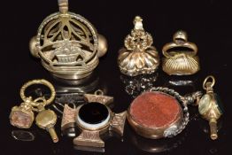 Three Victorian seal fobs set with carved agate intaglios, two Victorian watch keys, 9ct gold swivel
