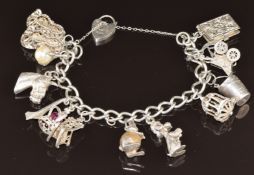 Silver charm bracelet with 13 silver charms including horse, poodle, rabbit, etc, 62.4g, 18cm