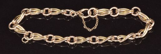 A c1920 9ct rose gold bracelet made up of circular and twisted links, 15.9g, 18cm long