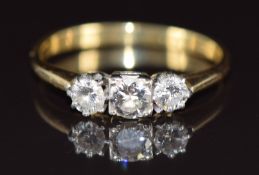 An 18ct gold ring set with three diamonds, of approximately 0.28ct, 0.2ct and 0.2ct, 3g, size Q
