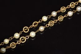 An 18ct gold necklace made up of cage links and cultured pearls, 15g, 46cm long