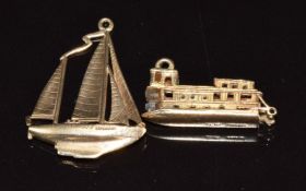 Two 9ct gold charms in the form of boats, 8.5g
