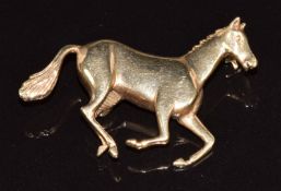 A 9ct gold brooch in the form of a horse, 6g, 3.5 x 2cm