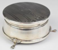 Elizabeth II hallmarked silver circular dressing table jewellery casket with engine turned
