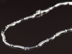 A 9ct white gold necklace made up of smooth and brushed links, length 42cm, 17.2g
