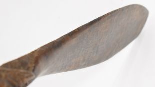 A 19thC Maori / New Zealand paddle hoe with scrolling decoration to the blade and carved grip to the