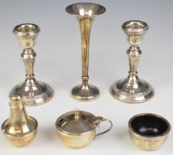 Hallmarked silver mounted items comprising pair of candlesticks, height 10.5cm, trumpet vase and a