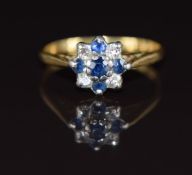 An 18ct gold ring set with diamonds and sapphires in a platinum cluster setting, 2.7g, size L