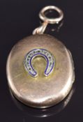 Victorian / Edwardian 9ct rose gold locket set with rose cut diamonds and blue enamel in a horseshoe