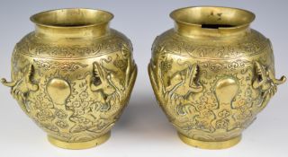 Pair of Chinese bronze jardinières with dragon decoration in relief and seal marks to base, height