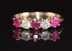 A 14k gold ring set with round cut rubies and old cut diamonds, each approximately 0.2ct, 2g, size