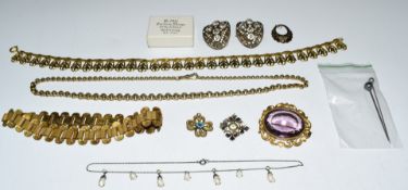 A collection of costume jewellery including paste buckles, Art Nouveau pierced necklace, Edwardian