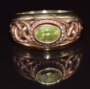 Clogau 9ct gold ring set with an oval cut peridot, with pierced Celtic shoulders, 5.3g, size M