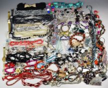 A collection of costume jewellery including earrings, watches, glass necklace, silver earrings etc