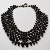 A 19thC French jet collar necklace stamped 'made in Austria'