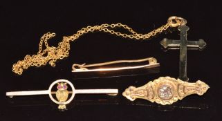 A 9ct gold cross, 9ct gold section of chain and three 9ct gold brooches, one in the form of an owl