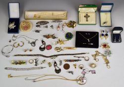 A collection of costume and silver jewellery including Swarovski brooch, silver bangle, Exquisite