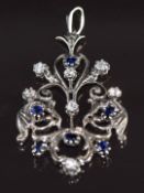A 9ct white gold pendant set with round cut diamonds and oval cut sapphires, 8.2g, 4.5 x 3cm