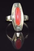 A 14k gold ring set with a coral cabochon, 3.6g, size M