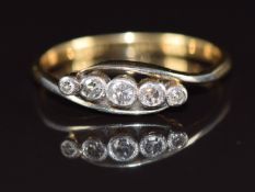 An 18ct gold ring set with five diamonds in a platinum setting, 2.6g, size P